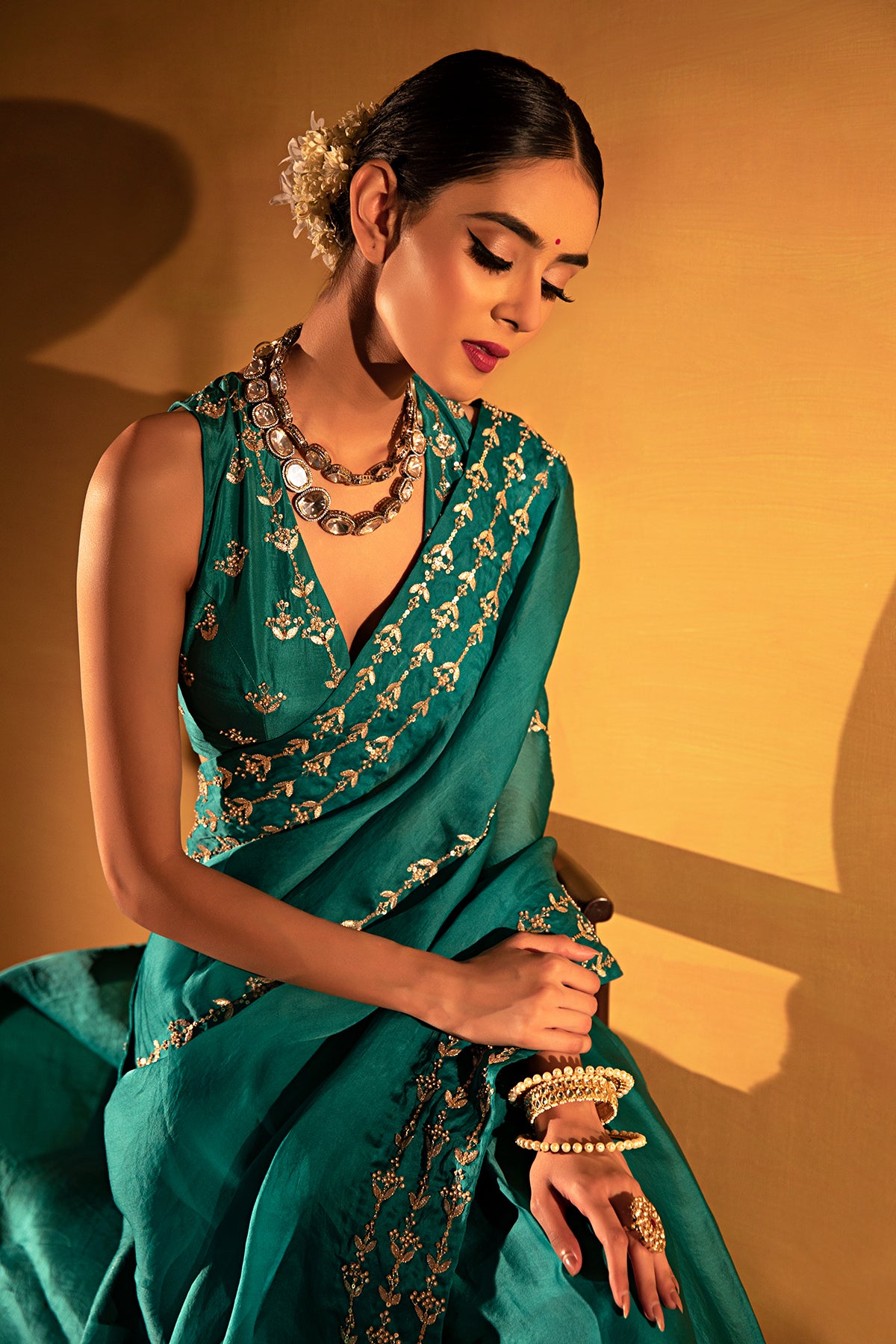 Teal green organza saree