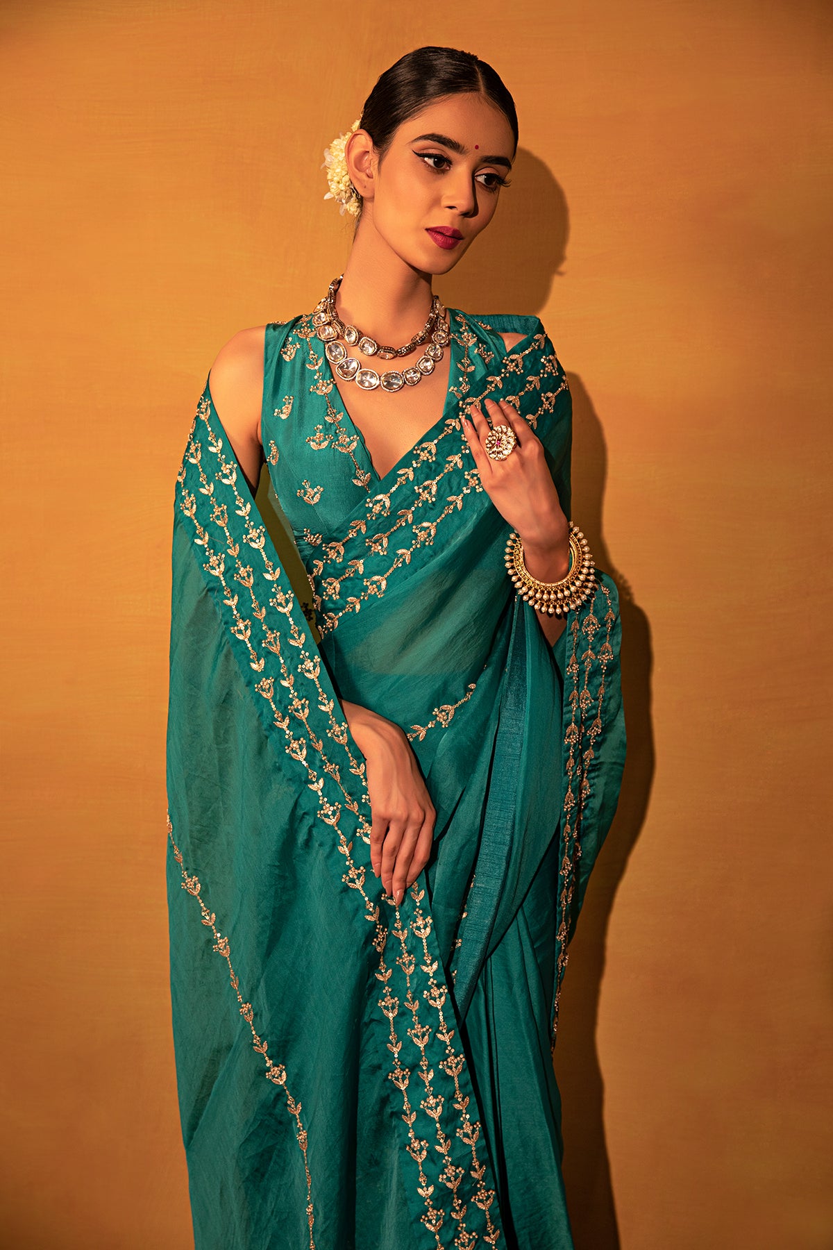 Teal green organza saree